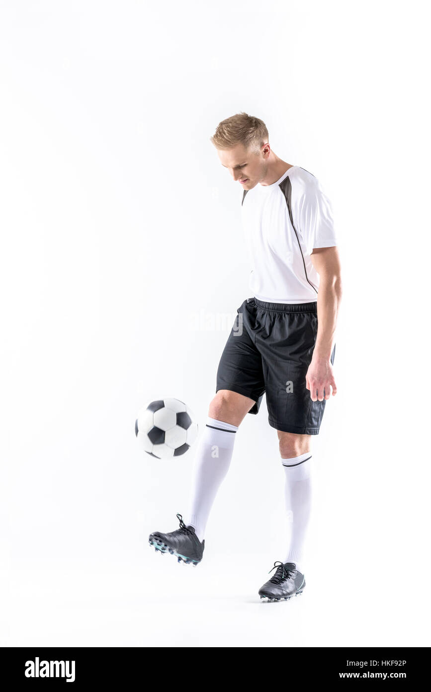 Soccer player exercising with ball Stock Photo