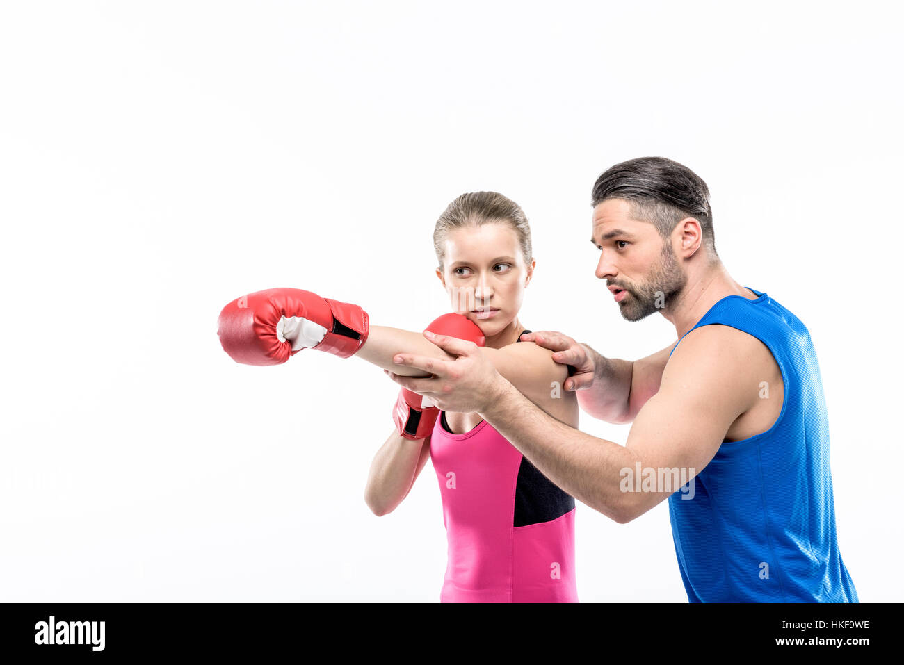 Girl practicing boxing with trainer Stock Photo