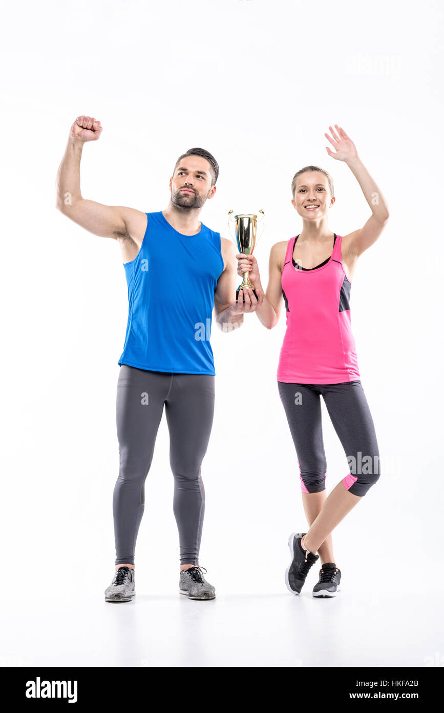 Sportive couple with award cup Stock Photo