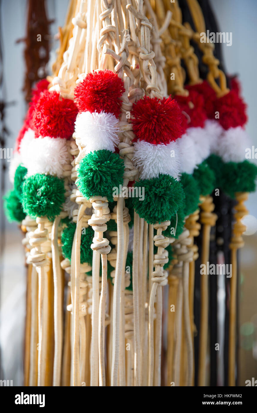 Fancy leather whips for sale in hungarian national colors Stock Photo