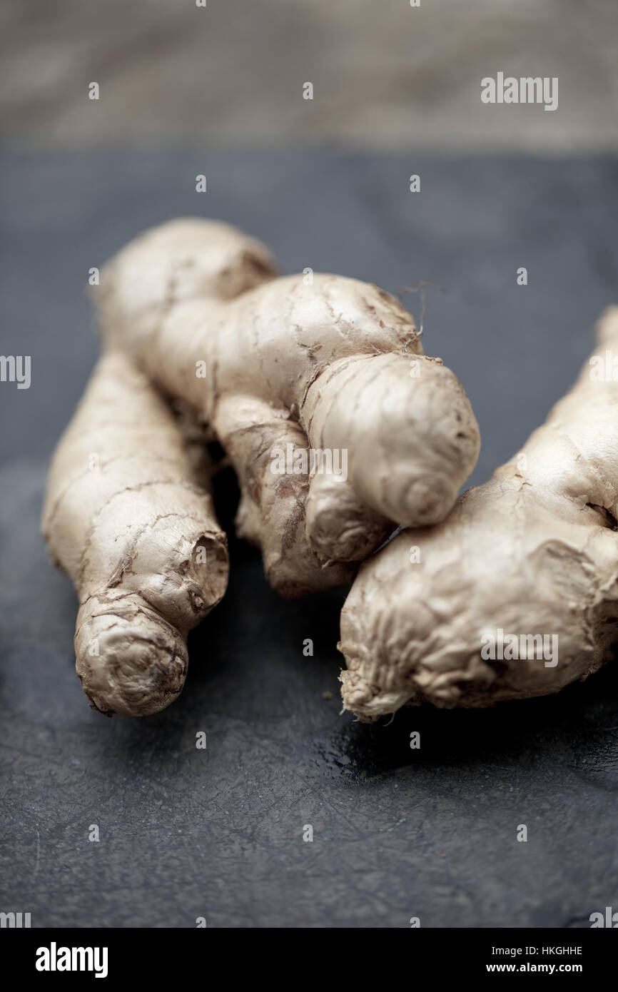ginger on black surface. ingredient, raw, food, asian food. Stock Photo