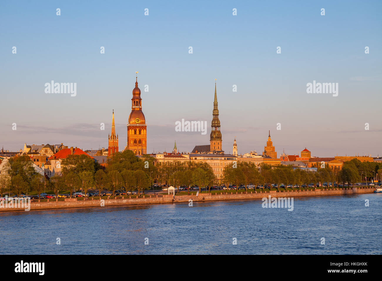 Old town of Riga at sunset, orange mood. Waterfront of old town over ...