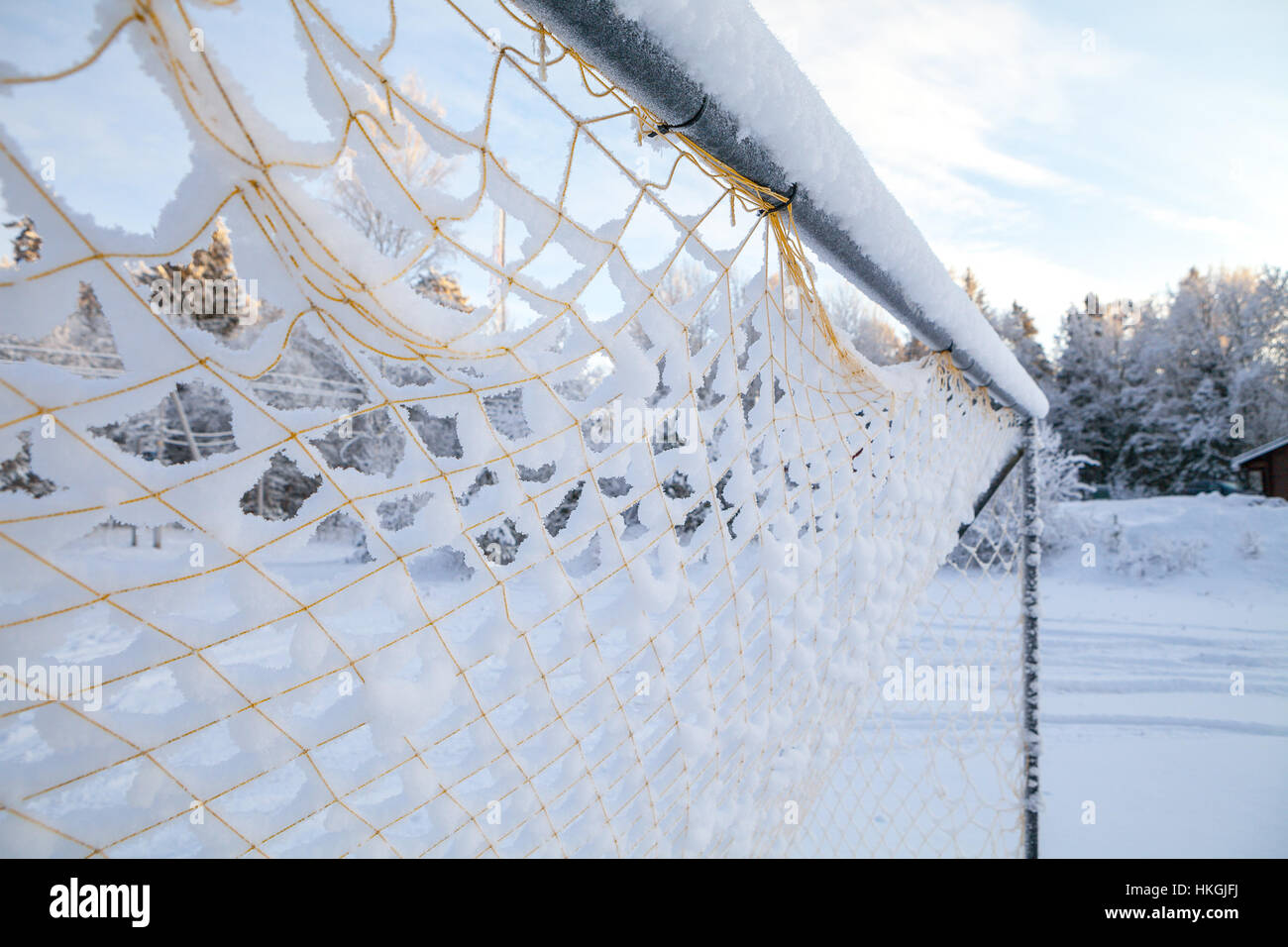 Vintage football goal net, covered with snow Stock Photo - Alamy