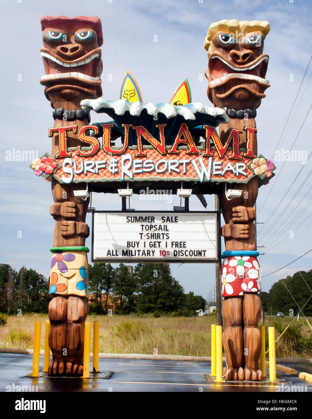 The colorful Tsunami Surf Shop in Sneads Ferry, North Carolina, draws beachgoers with bold seaside style and coastal surf culture charm. Stock Photo