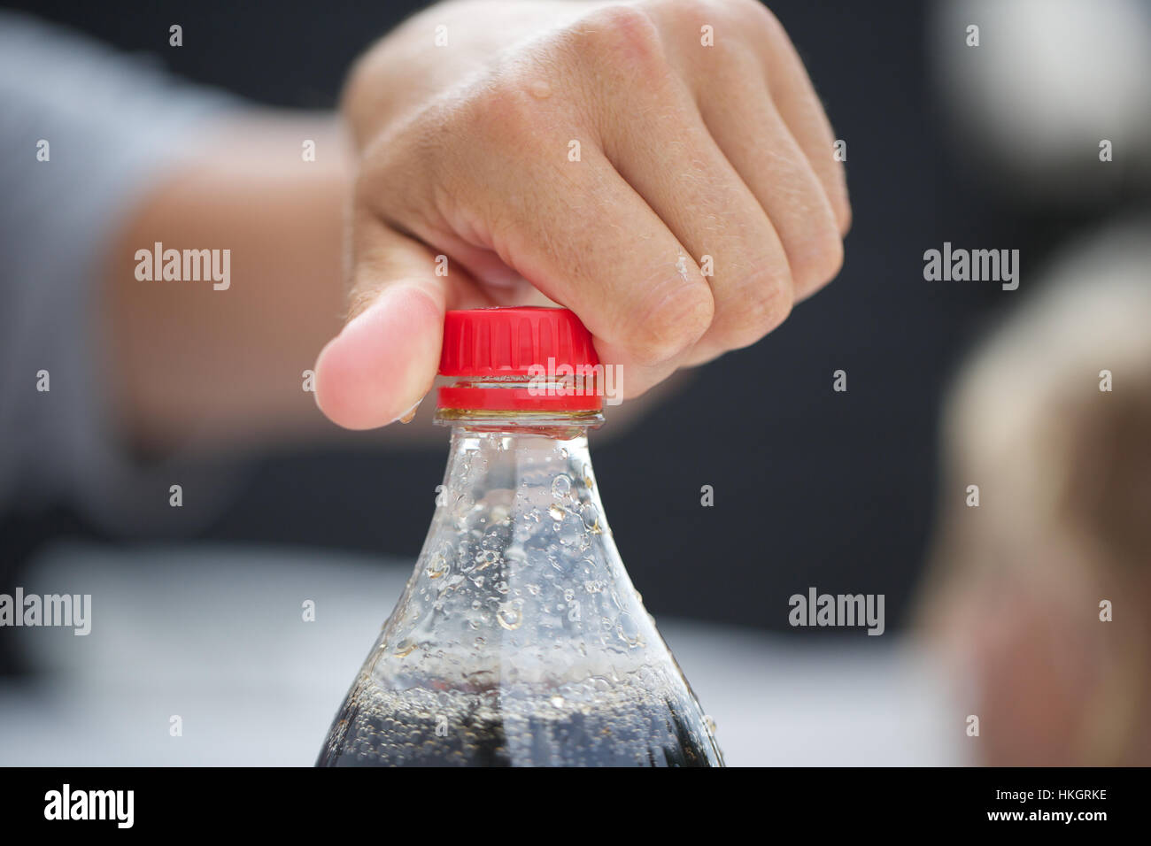 Hand holding coca cola bottle hires stock photography and images Alamy