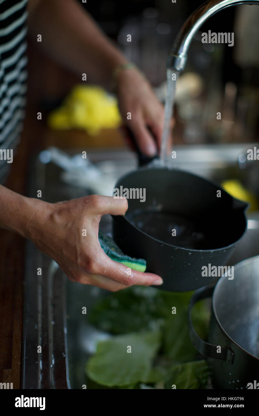 hands washing saucepan. kitchen sink, cleaning, hygiene, water Stock