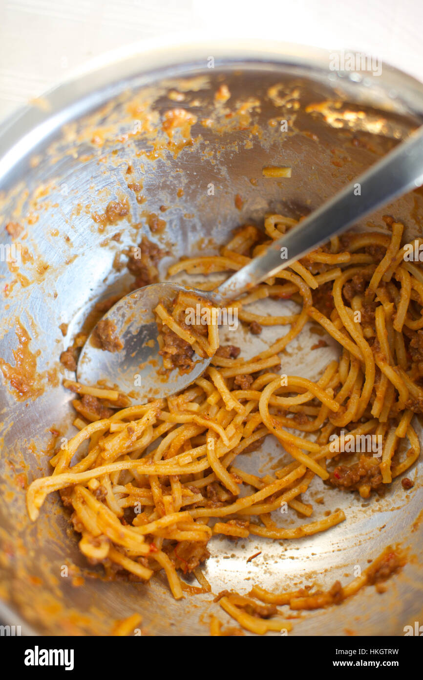 leftover spaghetti in bowl. spoon, stainless, meal, homemade Stock