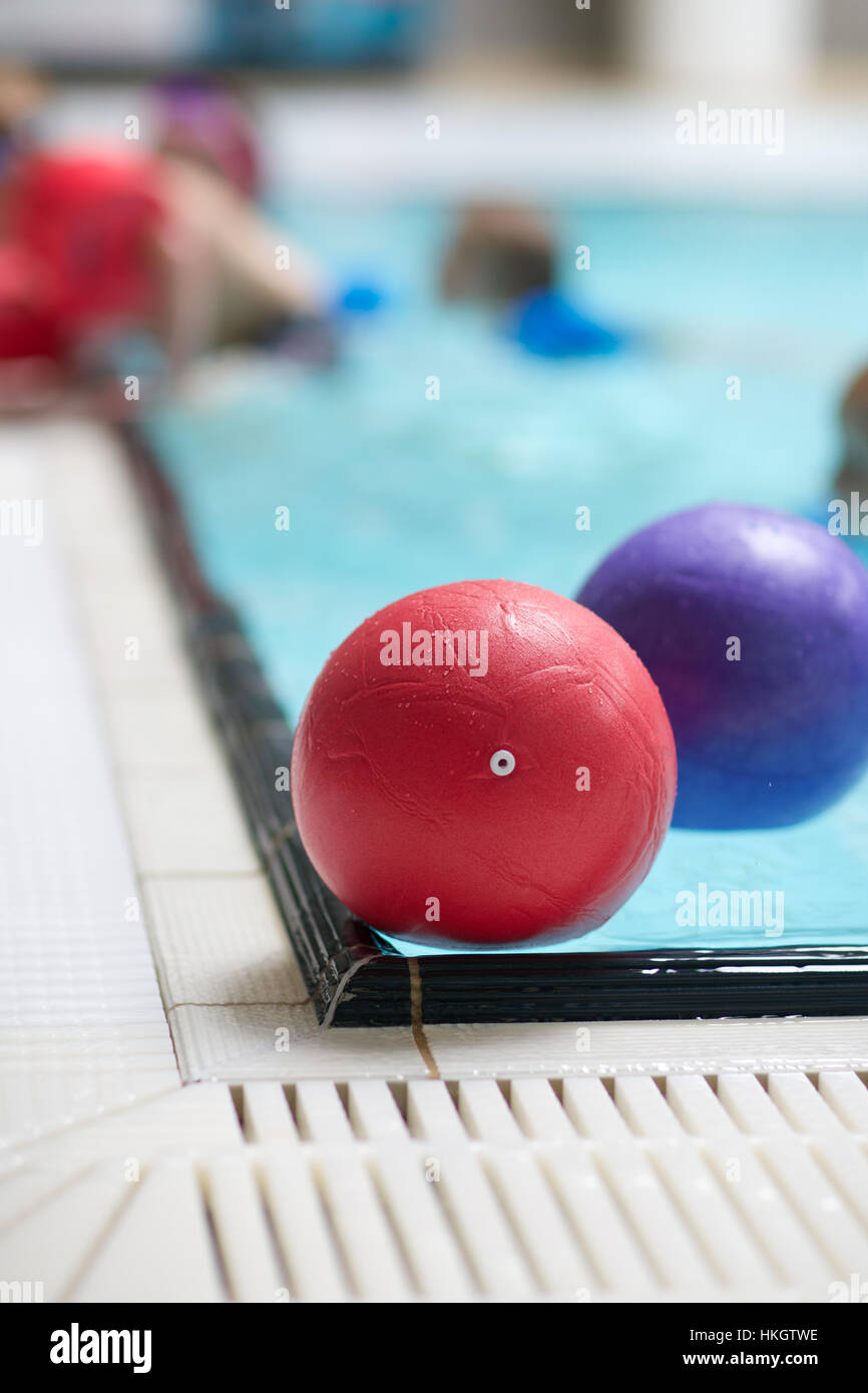 balls floating at swimming pool. inflated, poolside, float, tiled Stock
