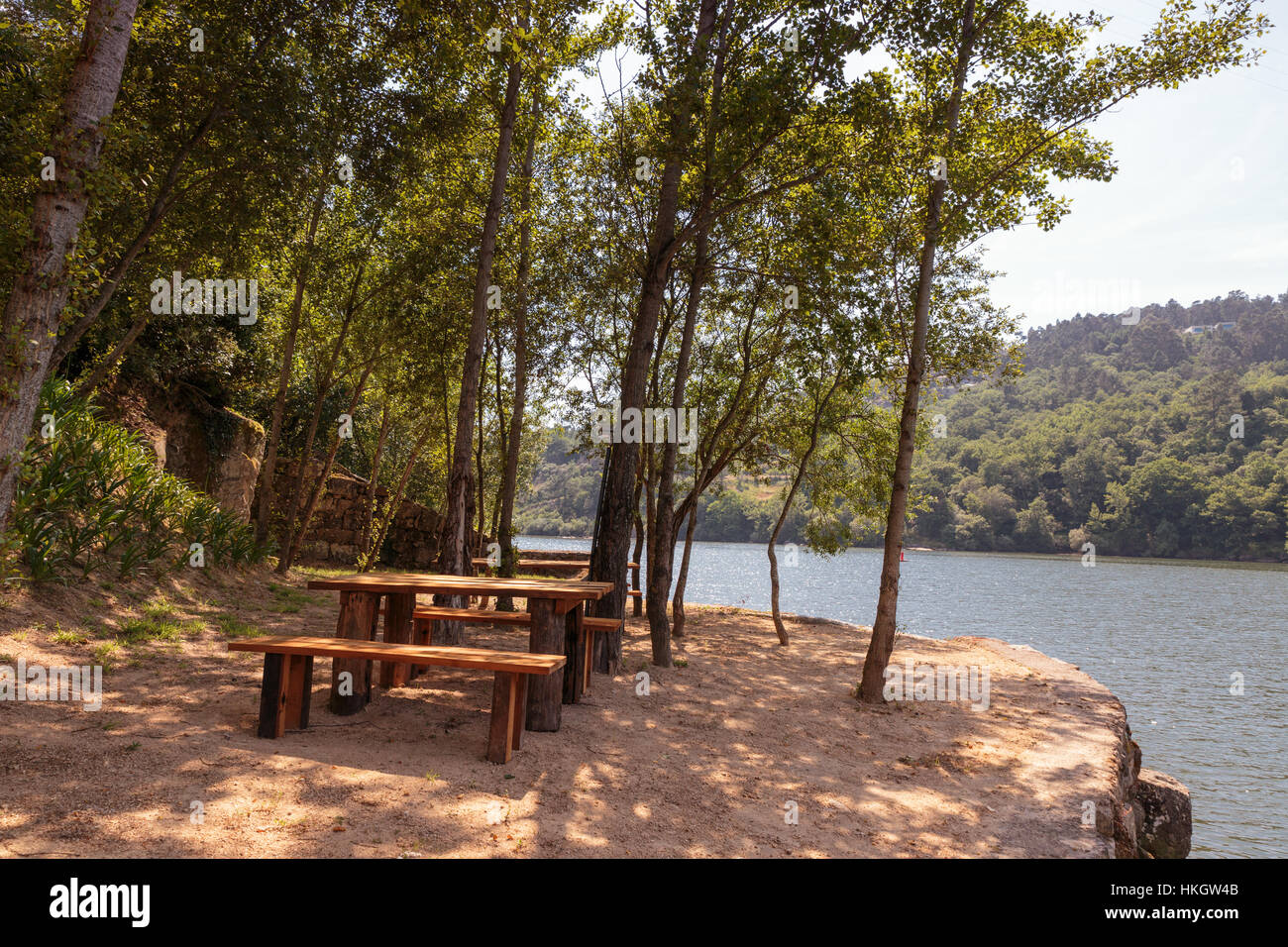 Picnic bench table by the river Stock Photo Alamy