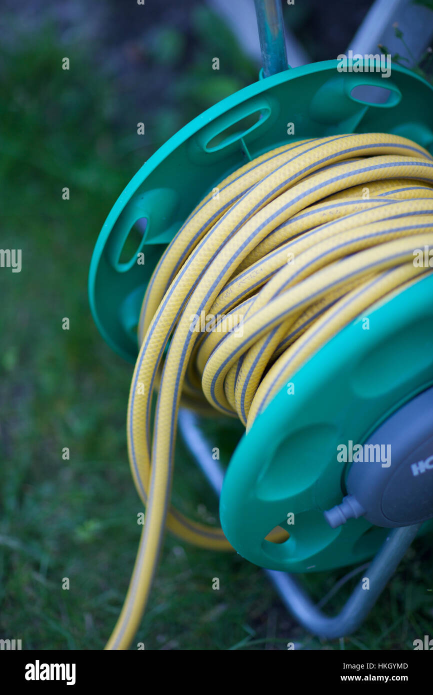 hose reel at garden. equipment, pipe, pattern, portable Stock Photo Alamy