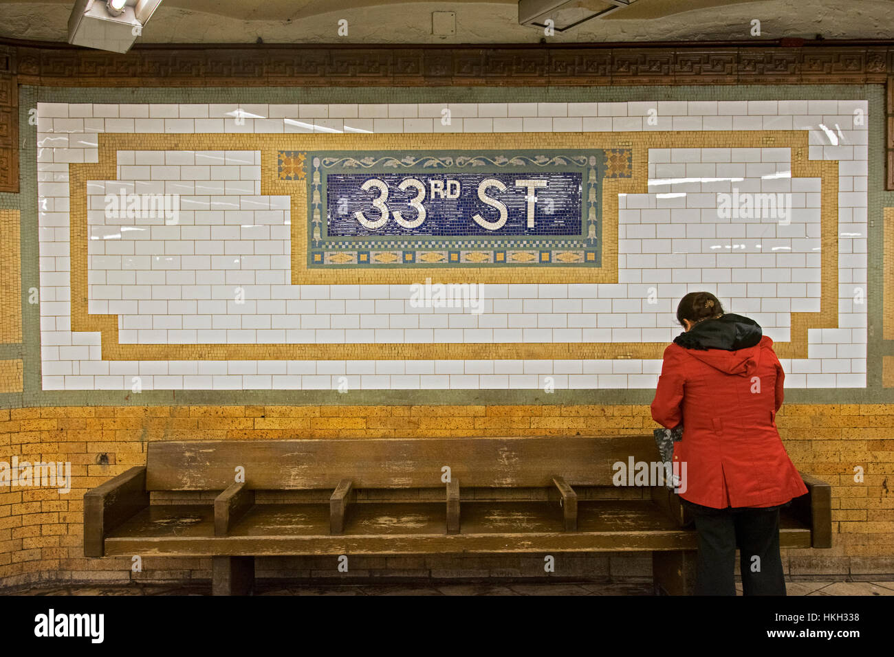 An Unidentified Woman At The 33rd Street Subway Station In Front Of A ...