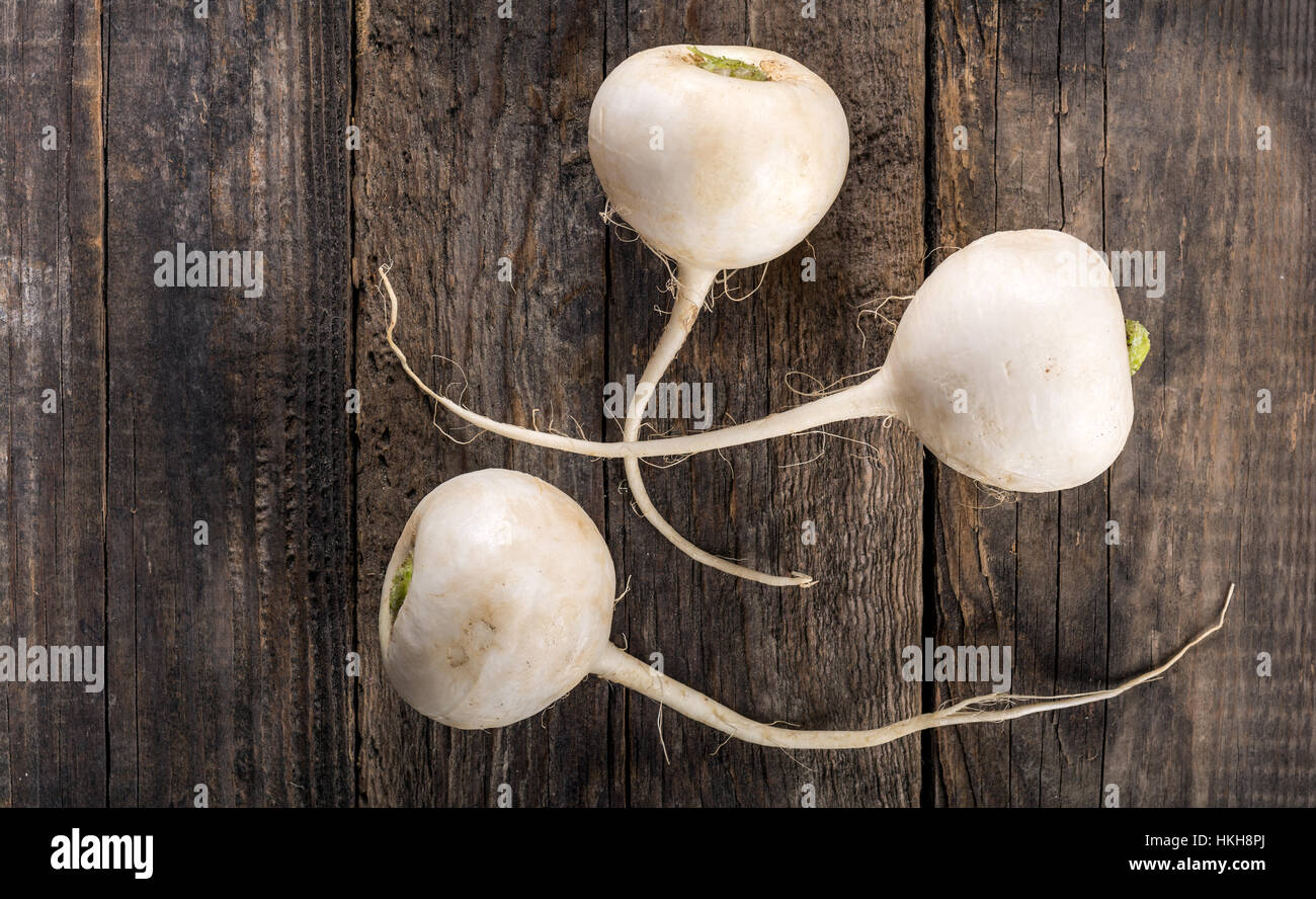 Turnip on wooden table Stock Photo