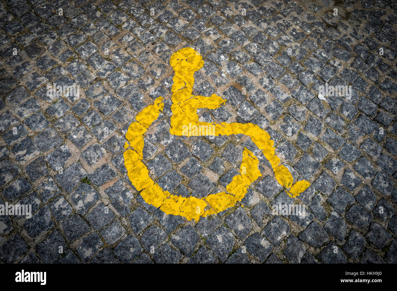 Disabled parking space with yellow painted sign Stock Photo