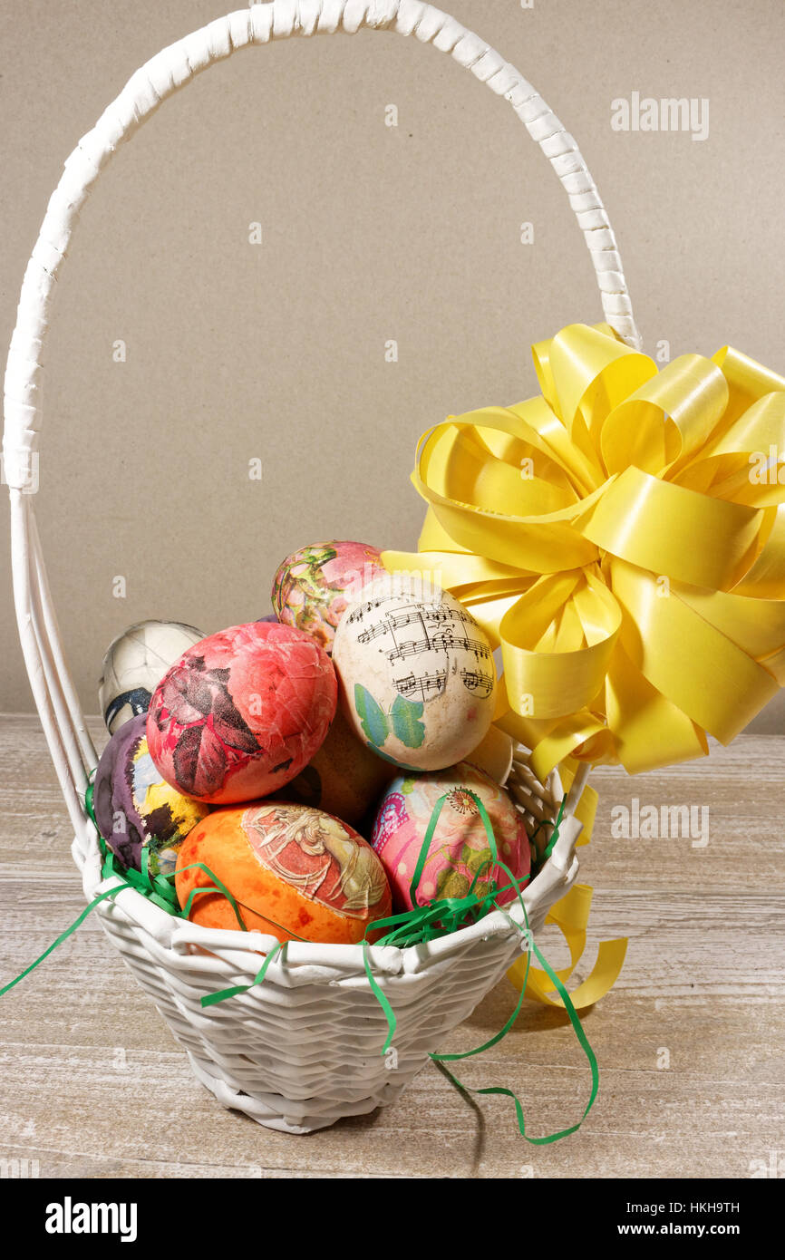 Decoupage decorated colorful Easter eggs in wicker basket Stock Photo ...