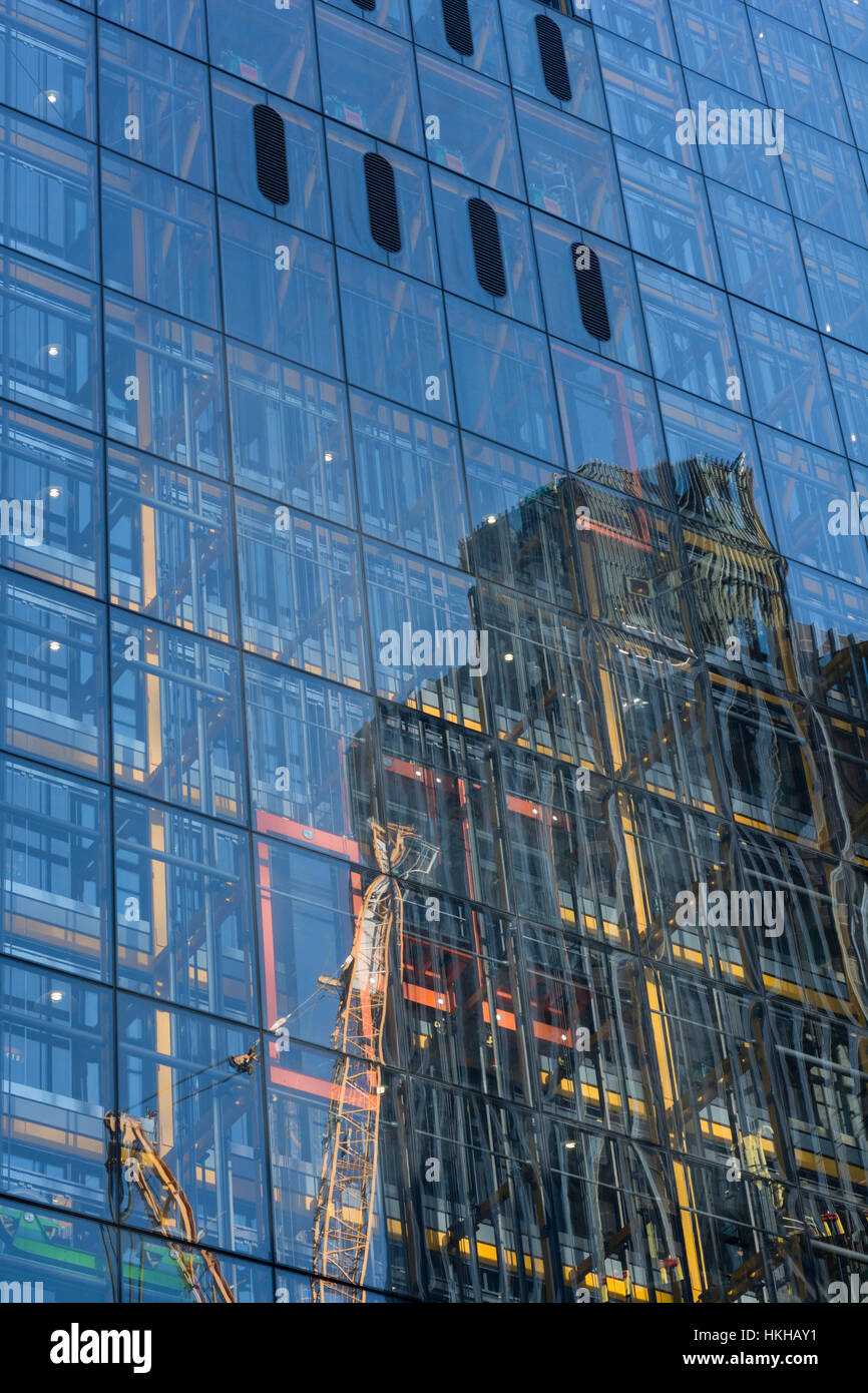 Office building reflection in the City of London financial district, or close by. Metaphor climbing corporate ladder, career ladder, glass reflections Stock Photo