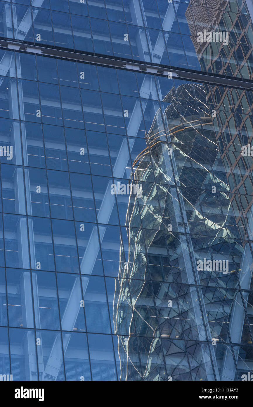 Office building reflection in the City of London financial district, or close by. Metaphor climbing corporate ladder, career ladder, glass reflections Stock Photo
