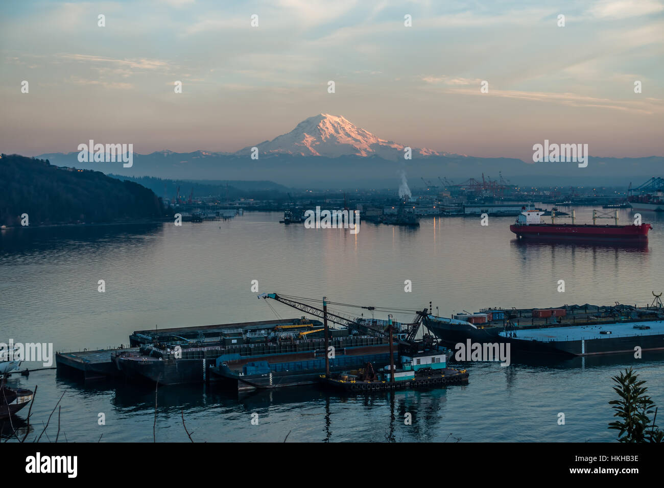 A view of the Port of Tacoma and Mount Rainier at sunset Stock Photo ...