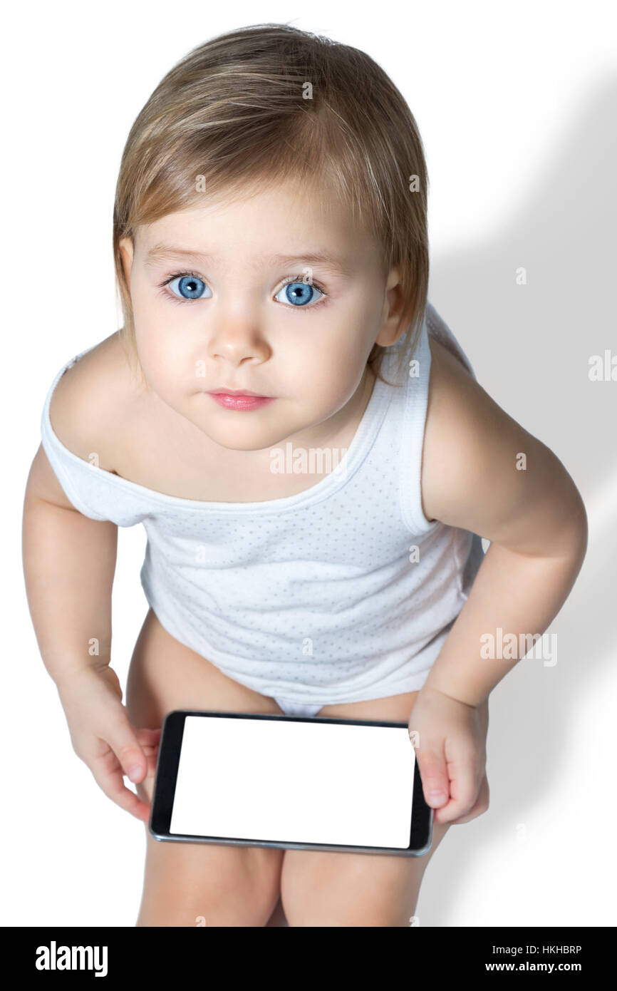 Little kid with a smartphone Stock Photo