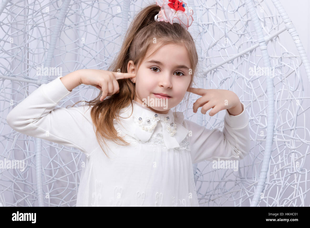 Girl covering her ears Stock Photo Alamy