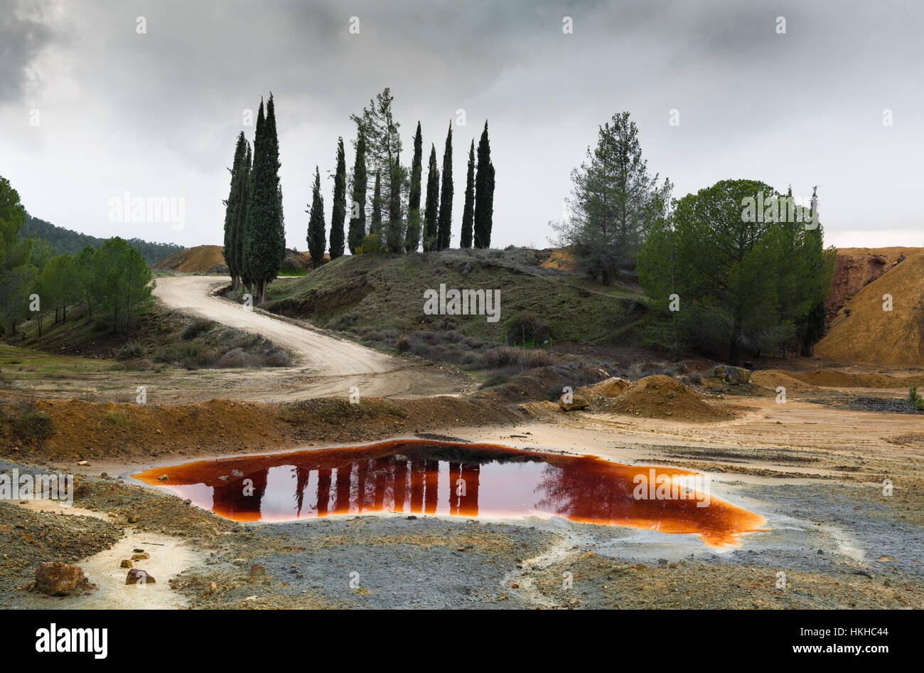 Lake with red polluted toxic water of an Abandoned copper mine at