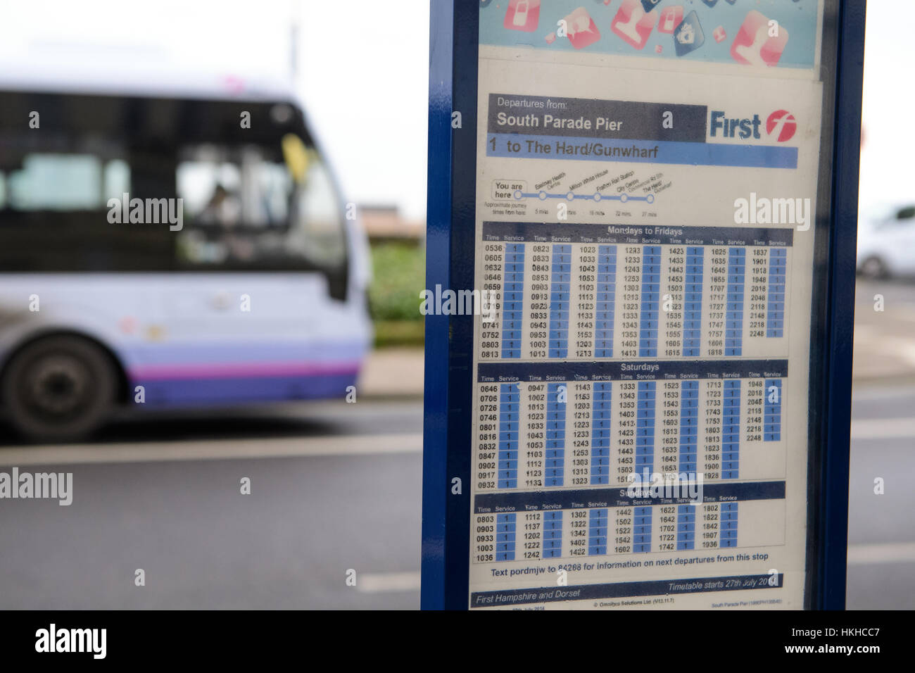 Bus timetable and single decker bus, Southsea, Hampshire, UK Stock