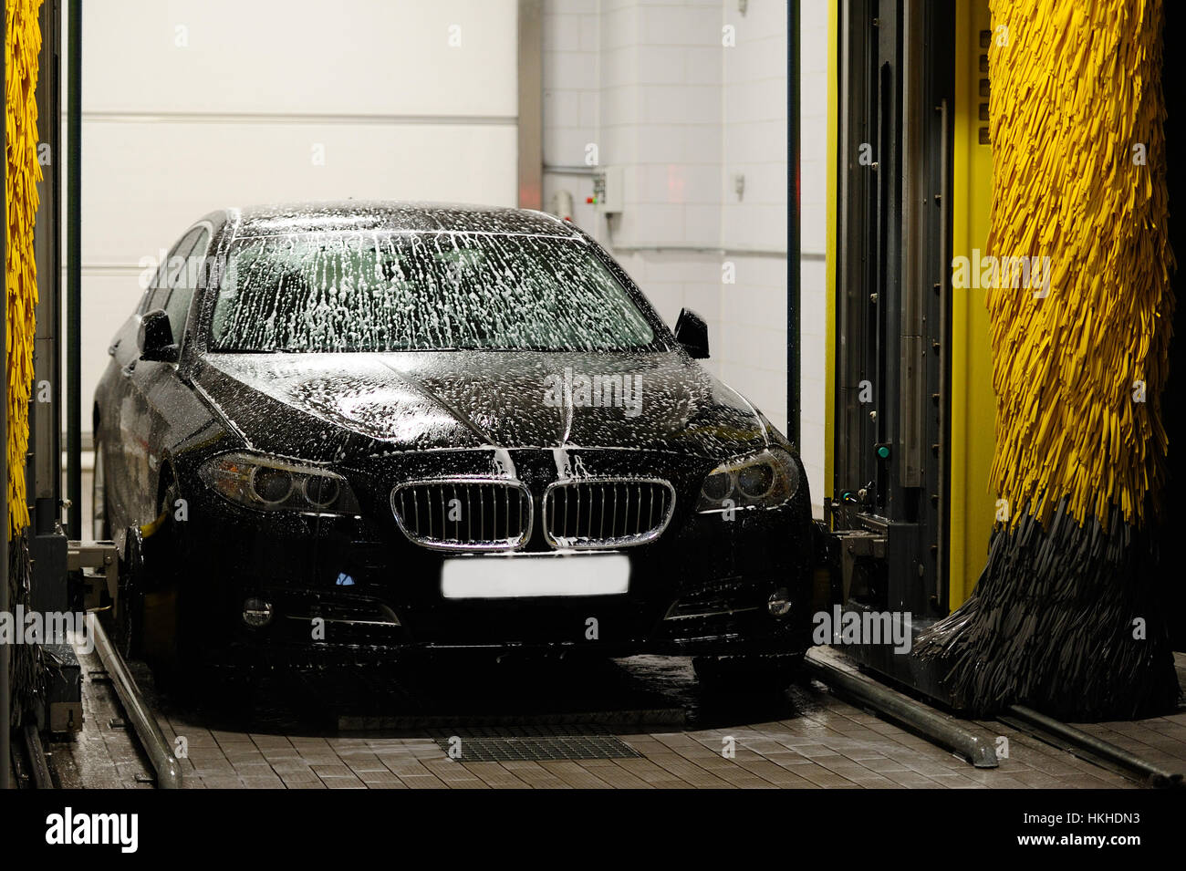 Black car washing in station washing tunnel Stock Photo