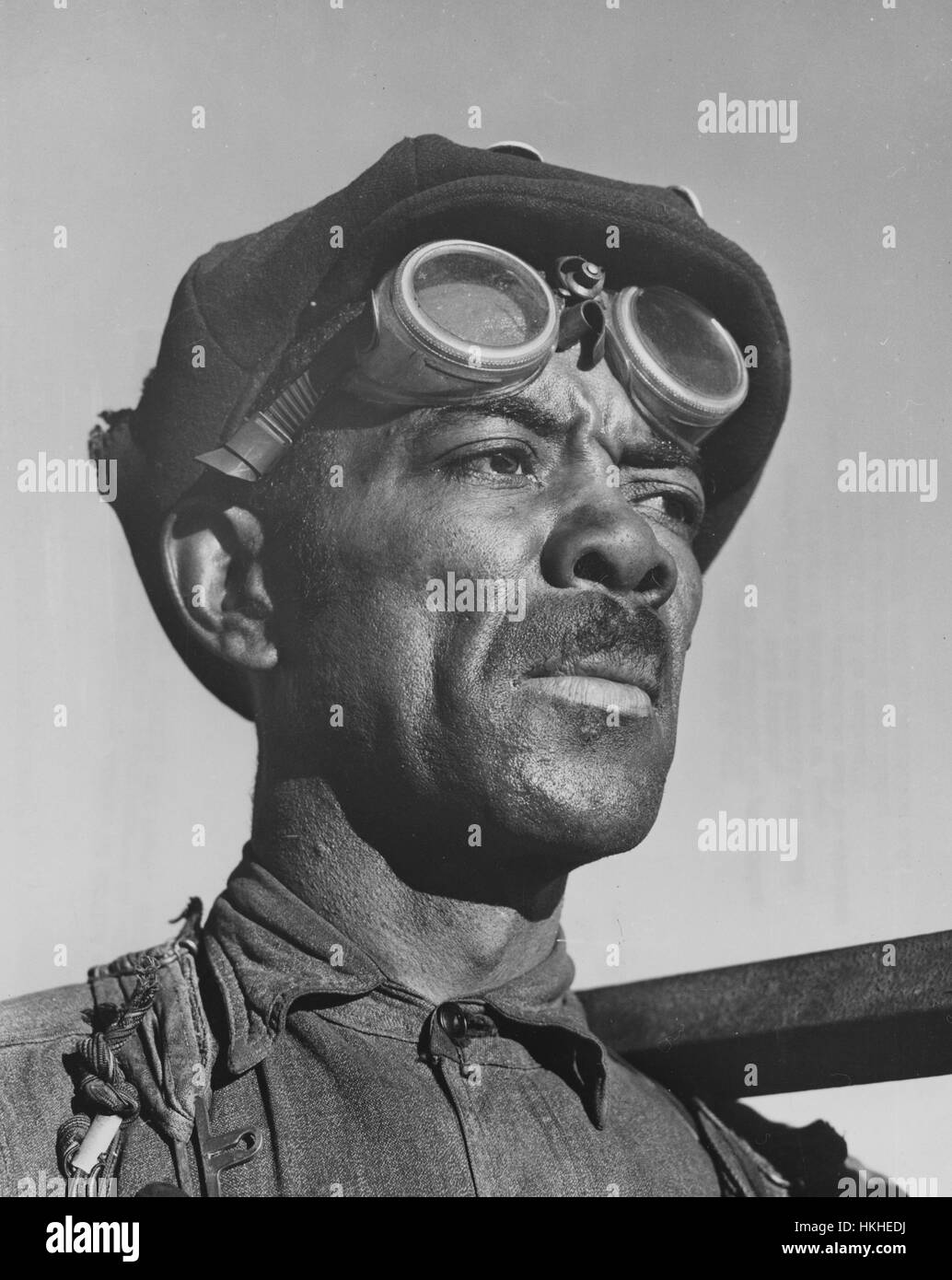 Portrait of an African American railroad worker, wearing a cap and goggles, April, 1943. From the New York Public Library. Stock Photo