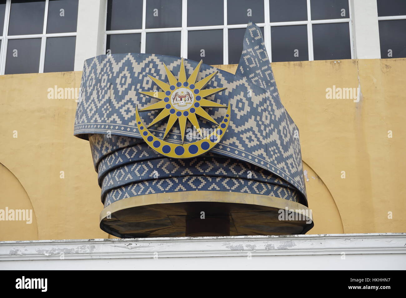 replica of tengkolok, a traditional Malay male headgear, with national emblem of Malaysia Stock Photo