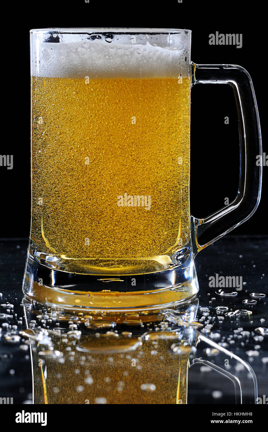 beer glass on wet table with drops Stock Photo