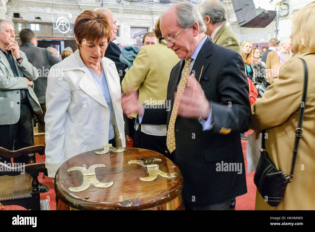 Antiques expert John Bly describes an oak and brass table at the filming of the Antiques Roadshow, Belfast Stock Photo