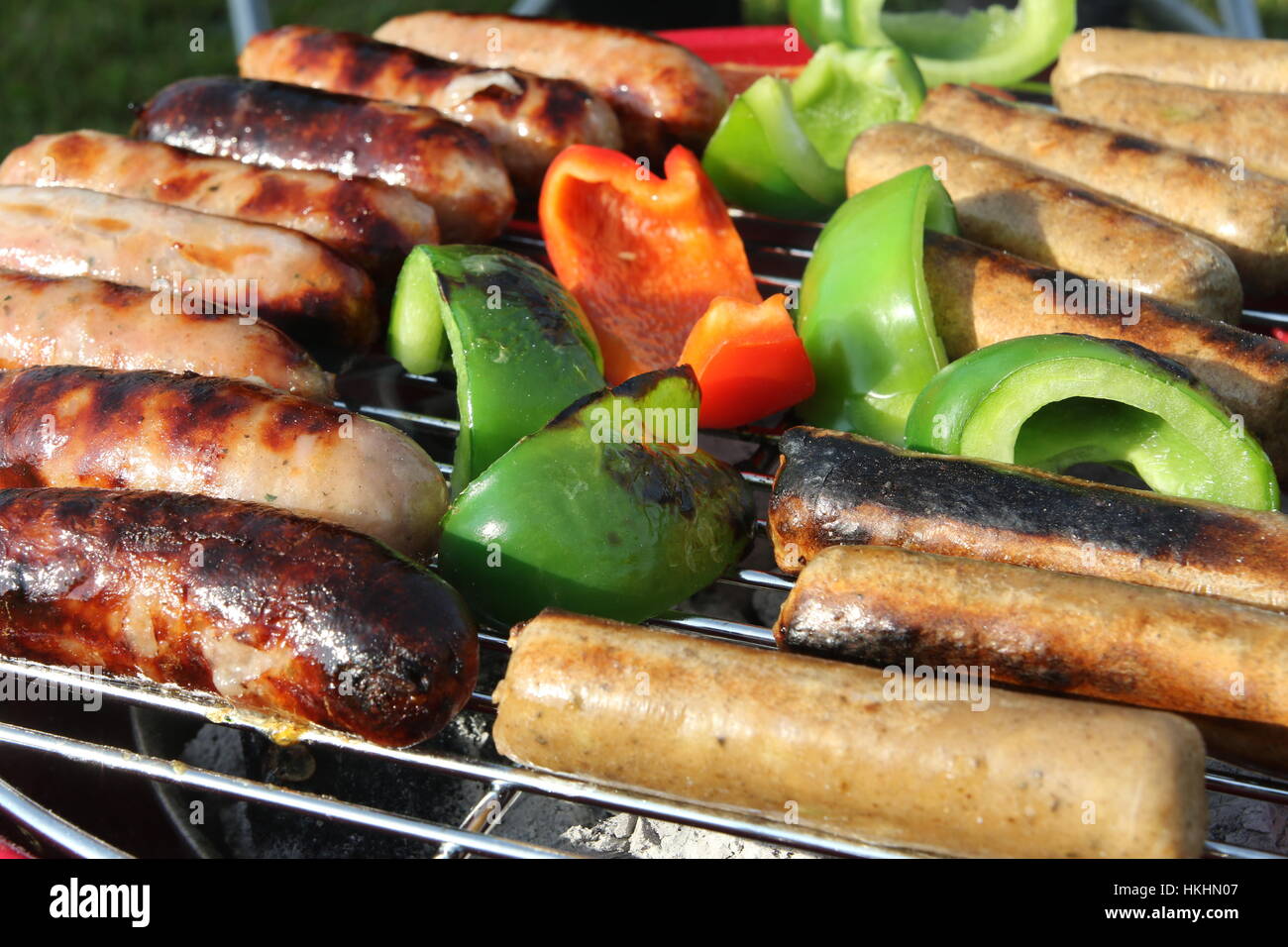 Sausages and peppers on BBQ Stock Photo Alamy