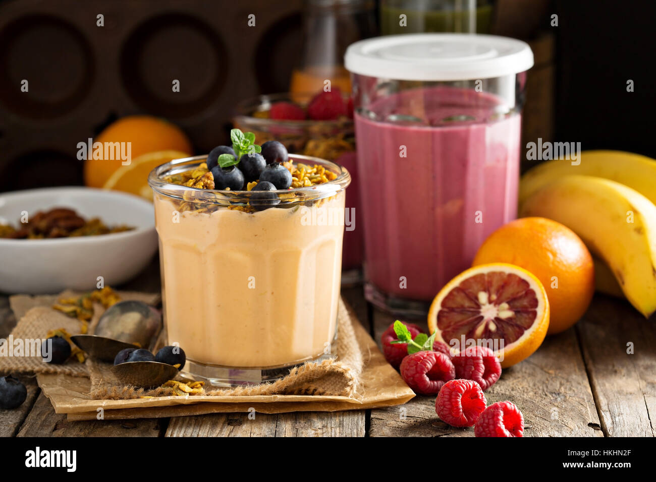 Orange mango smoothie with granola Stock Photo