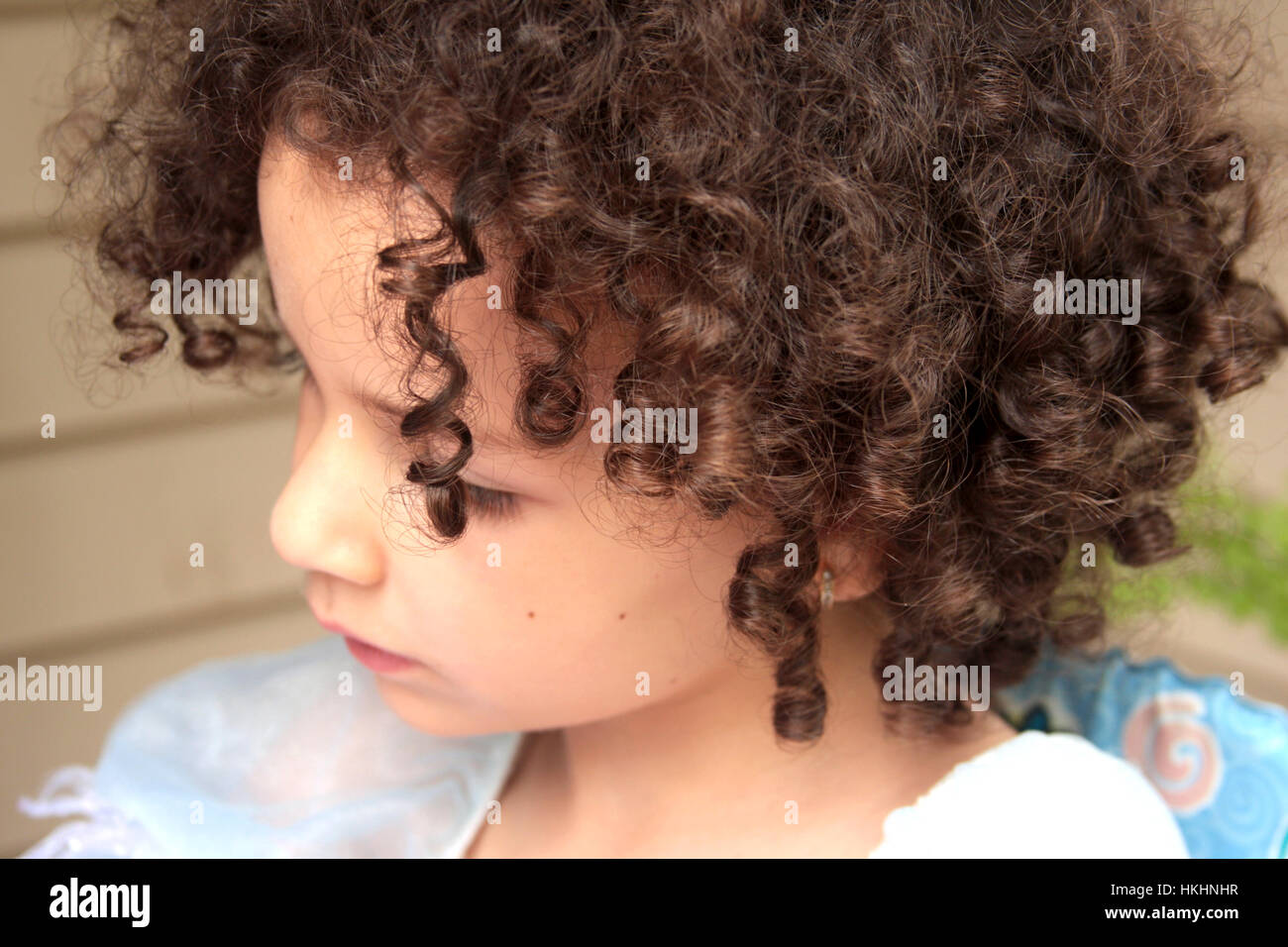 Little Caucasian Girl With Natural Curly Hair Stock Photo