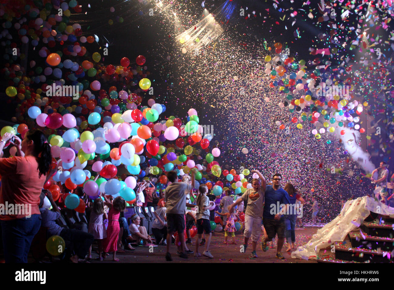 Thousands of balloons and confetti falling at culmination event for TRBC's Vacation Bible School in Lynchburg, Virginia Stock Photo