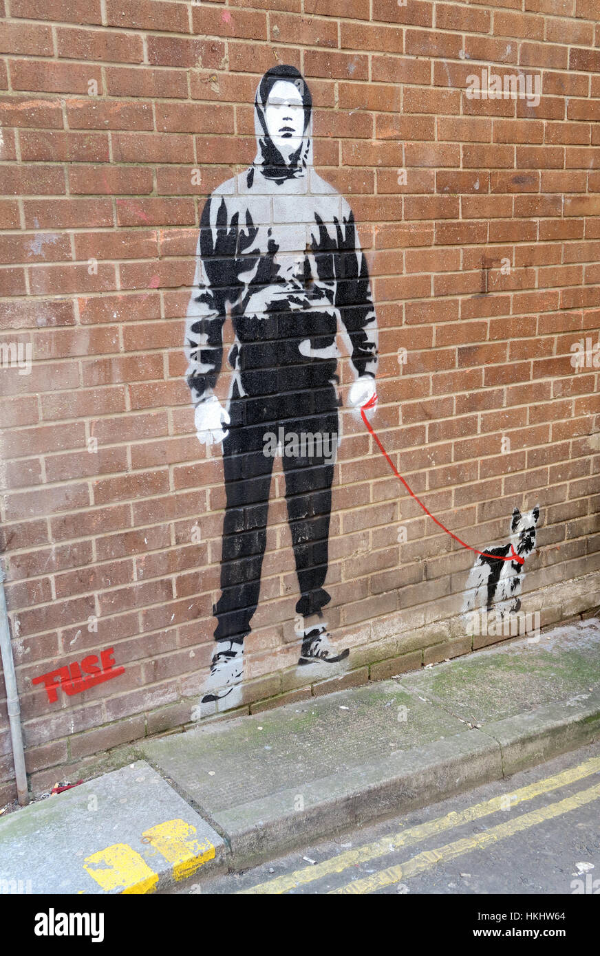 Boy walking dog stencil,Glasgow Queen St, Scotland Stock Photo