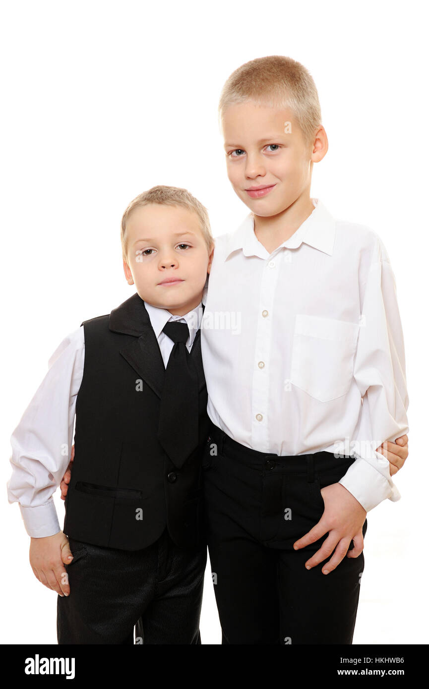 kids in suit hug on white background Stock Photo