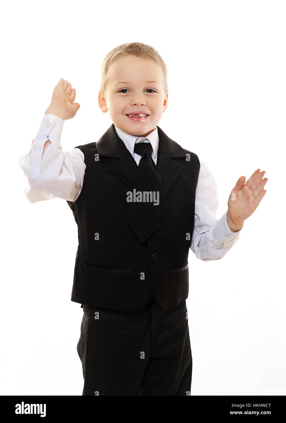 happy boy kid in black suit isolated on white Stock Photo