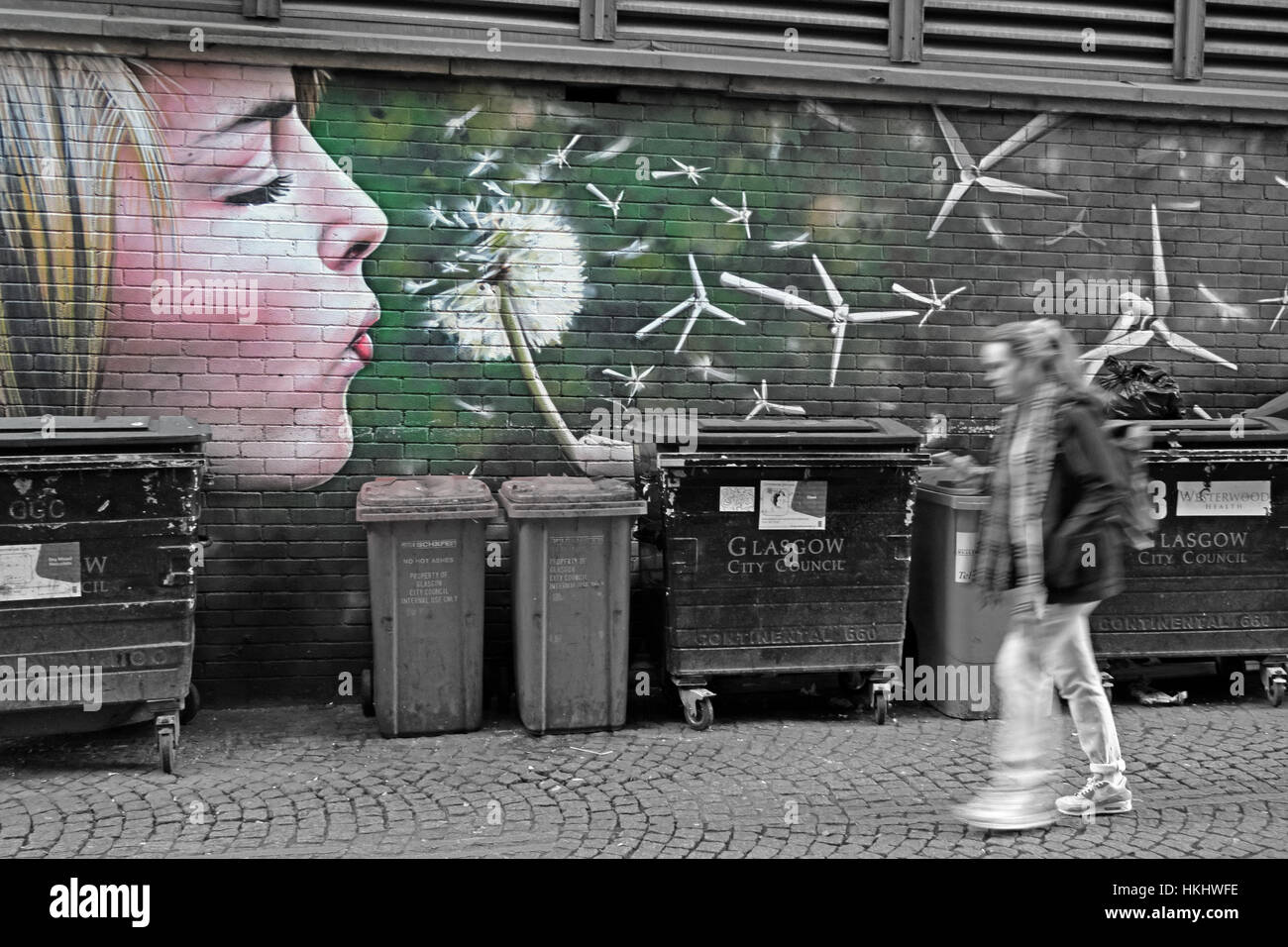 Girl blowing flower, Glasgow Stock Photo