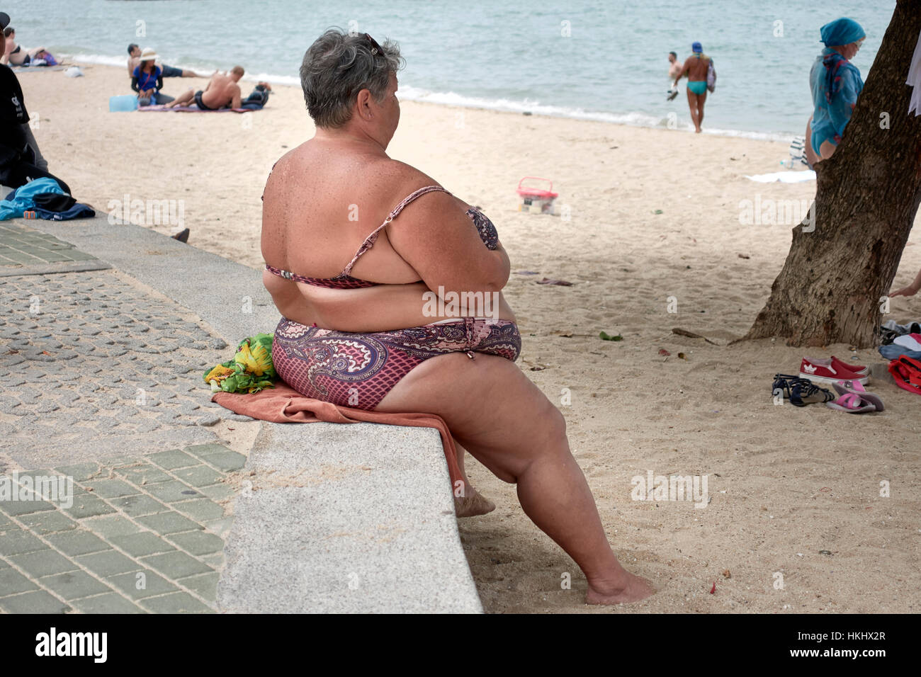 Overweight woman in bikini