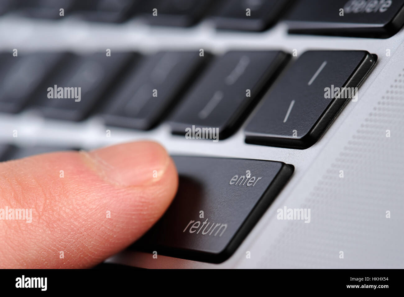 enter button press on laptop close up Stock Photo Alamy