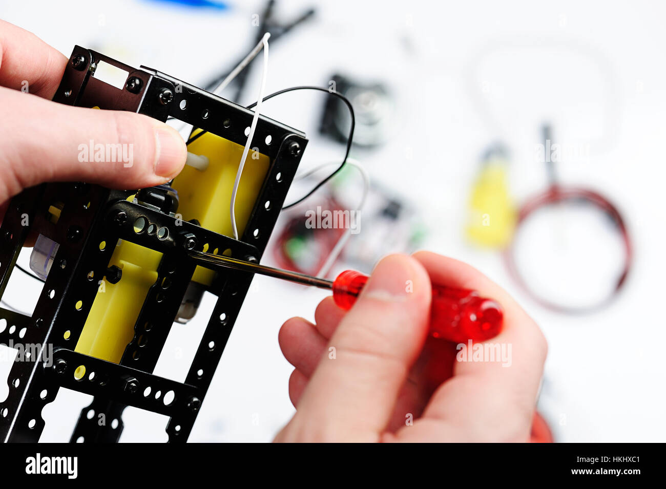 person assemble robot details close up Stock Photo