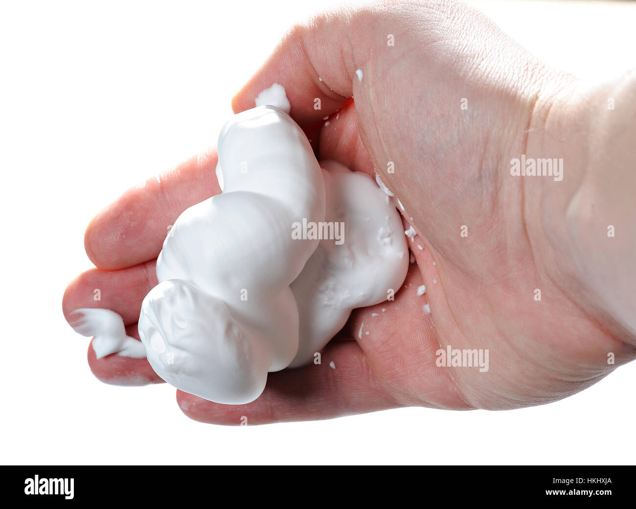 white shave foam in hand isolated background Stock Photo