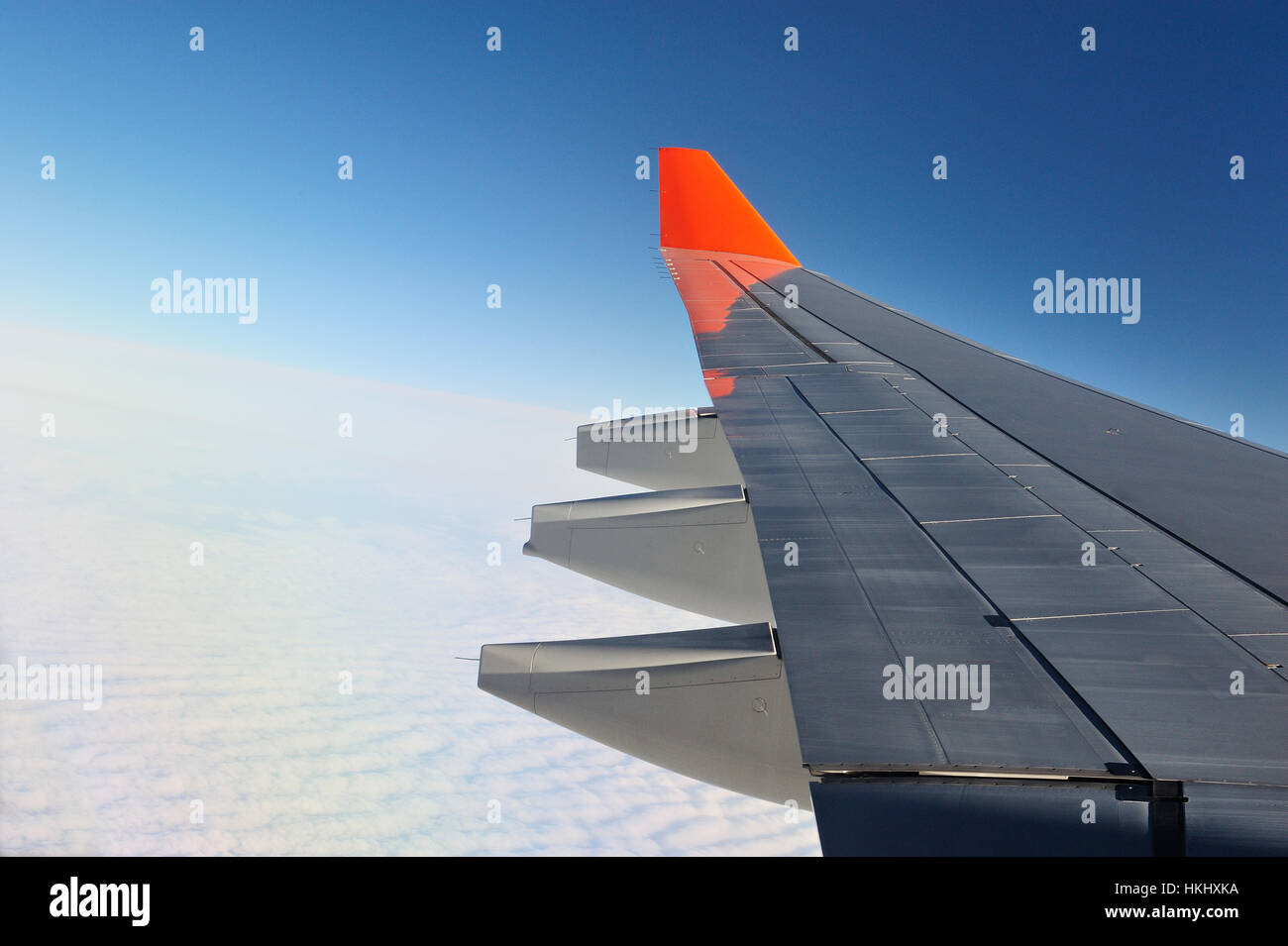plane wing in blue sky with white clouds Stock Photo - Alamy