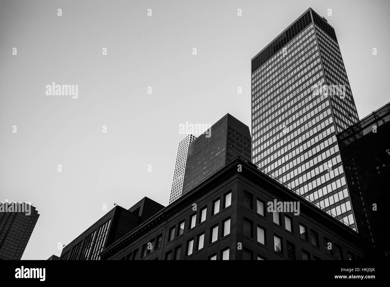 Black and white low angle view of skyscrapers and office buildings; New York City, New York, United States of America Stock Photo