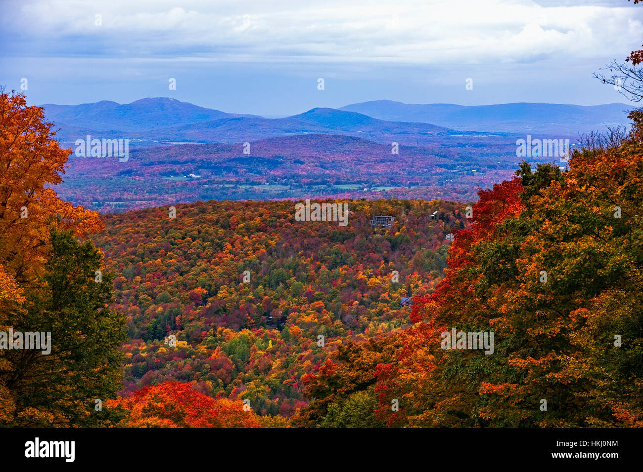 Mount Sutton and autumn coloured forest; Sutton, Quebec, Canada Stock