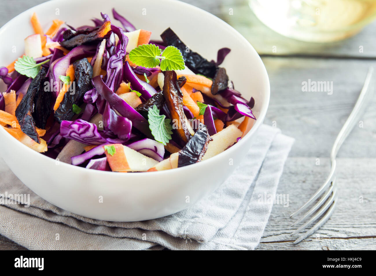 Red Cabbage Coleslaw Salad with Carrots, Apples and Prunes - healthy diet, detox, vegan, vegetarian, vegetable spring salad Stock Photo