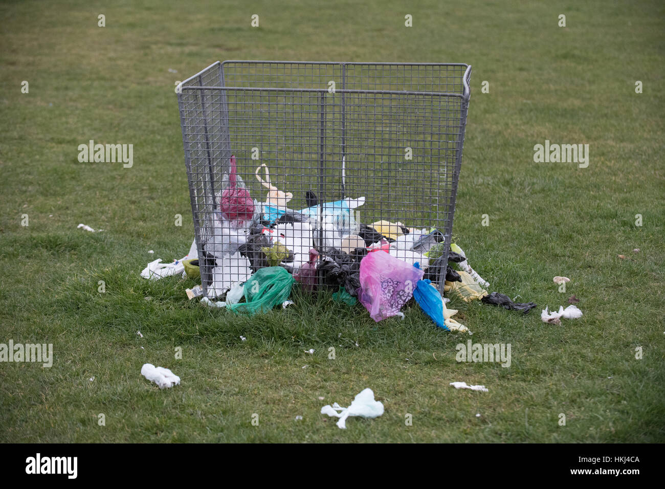 Plastic waste, rubbish, waste, trash pulled from mesh bin by gulls and birds, Southsea, UK Stock Photo