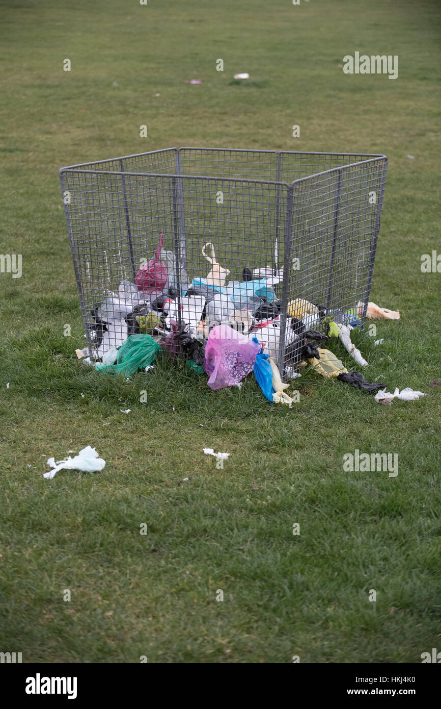 Rubbish, waste, trash in and around a bin Stock Photo Alamy