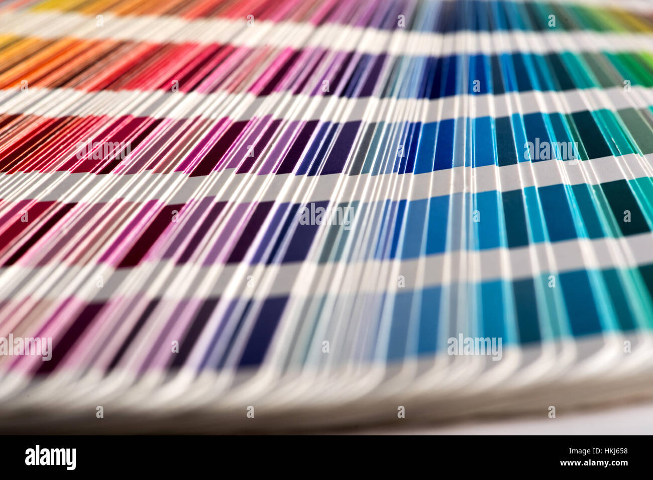 Close up selective focus shot of color sampler fan deck with shades of vivid colors. Background concept Stock Photo