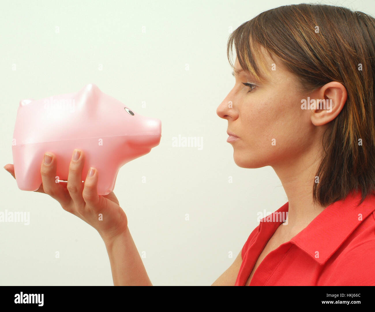 Young woman with piggy bank Stock Photo - Alamy